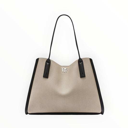 Triple H Treasures DKNY beige canvas tote bag with black leather accents and silver logo hardware.